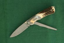 Hunting knife with a handsaw